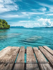 Fototapeta premium Beautiful clear turquoise waters and a wooden deck overlooking the ocean, with lush green islands and mountains in the background.