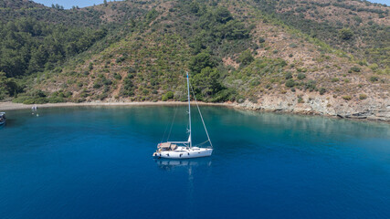 Aerial view of a sail boat on the shallow water. 
