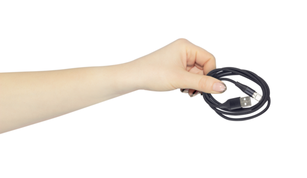 USB - Type-C cable in hand, outstretched hand with USB - Type-C cable, isolated from background