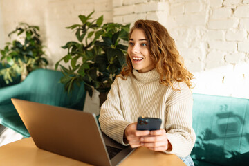 Woman freelancer using laptop while sitting in cozy cafe. Concept for education, business. Shopping online.