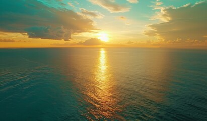Obraz premium Beautiful sunset over the ocean with a blue sky, scenic view, calm seawater, drone aerial shot