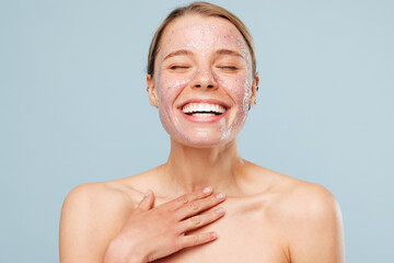 Beautiful satisfied happy half naked topless young woman with nude make up, pink jelly-like mask...