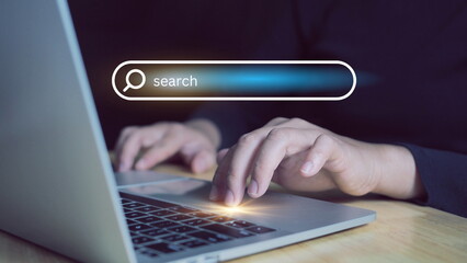 Professional online gamer hand fingers.Searching Browsing Internet Data Information with blank search bar.tablet and laptop computer on desk in office. Networking Concept