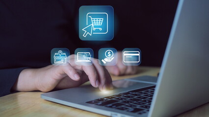 Online Shopping concept. Businessman use laptop with virtual screen of online shopping icon. Explore a seamless online shopping service with convenient home delivery options.