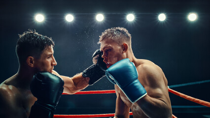 Intense Championship Boxing Match Between Two Male Fighters Under Bright Lights, Powerful Punches...