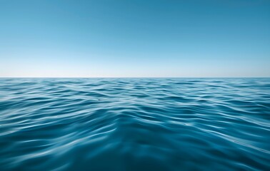 Obraz premium Tranquil Ocean Waves Under Clear Blue Sky