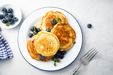 Homemade pancakes with blueberries and honey