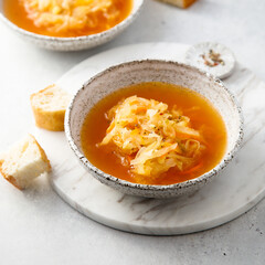 Homemade sauerkraut soup served with bread