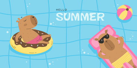 Funny capybaras floating in swimming pool
