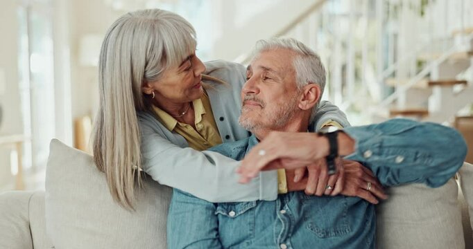 Mature couple, hug and love on sofa with happy marriage, support and talking of pension or security at home. Man and woman embrace on couch for commitment, health and wellness or trust and affection