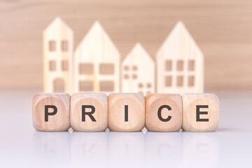visual representation of a real estate proposal using wooden blocks and house symbols