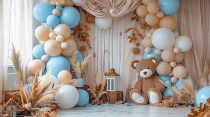 Beige, brown, and blue balloons backdrop, arch with bears. Photo-wall for celebration baptism or birthday party. Trendy autumn decor with dry leaves.