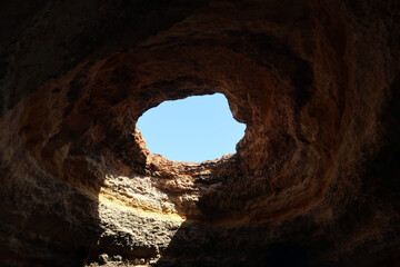 Praia de Benagil is located on one of the most beautiful stretches of the Algarve coast, where the jagged cliffs form caves and sinkholes. Algarve, Portugal.
