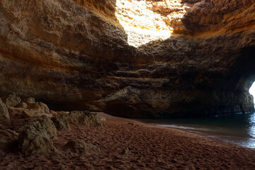 Praia de Benagil is located on one of the most beautiful stretches of the Algarve coast, where the jagged cliffs form caves and sinkholes. Algarve, Portugal.