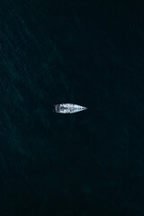 Aerial view to sailing yacht in the sea