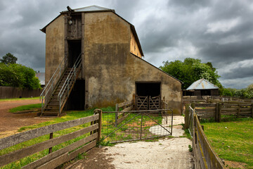 Old brick and render barn on the historic Brickendon Estate in Longford, Tasmania.