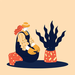 A gardener is meticulously tending to a houseplant