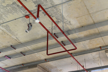 Ceiling mounted cassette type air conditioner in factory hall.