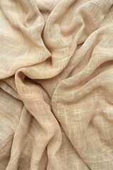 Soft beige fabric texture pattern background with crumpled folds. Natural material possibly cotton linen slightly wrinkled rustic charm. Close-up view of folded fabric reveals subtle design.