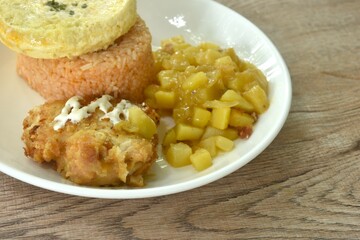 fried rice Japanese curry topping egg omelet eat couple crispy fried chicken dressing mayonnaise and potato salad on plate