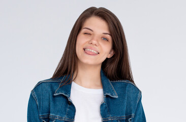 Portrait of attractive flirty cheerful girl winking good mood isolated over white background