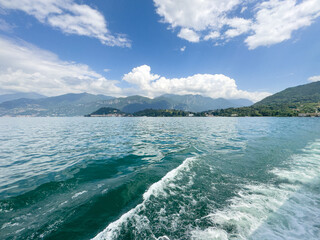 View at Lake Como and the Alps in Background and boats in foreground