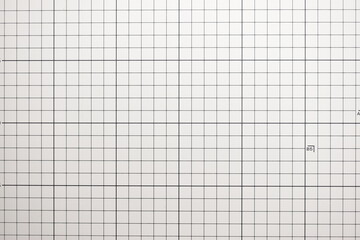 gray cutting mat board background with line and scale measure guide pattern for object art design,...