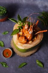 King prawn served in a green coconut, Red curry, Coconut milk curry