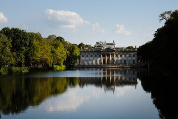 Fototapeta premium Sunset over the Palace Łazienki or Palace of the Water (Palace on the Isle) at Lazienki park in Warsaw, Poland