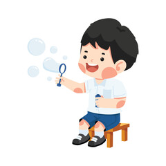 Kid student sitting blowing soap bubbles
