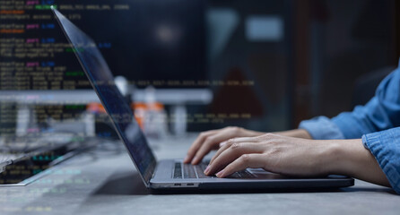 close up specialist student programmer hand type command of configuration on keyboard at laptop for check software for fix bug and defect of system in data center room , engineering and technology