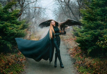 art portrait real people fantasy woman holding white-tailed eagle bird flaping open wings on hand....