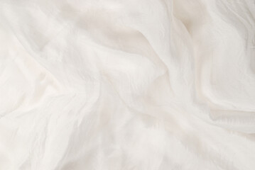 Soft smooth white silk fabric background. Fabric texture.