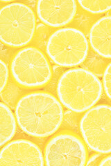 A slices of fresh juicy yellow lemons.  Texture background, pattern.