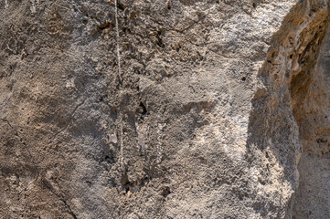 Stone wall. Light brown rock texture. Stone grunge backdrop.