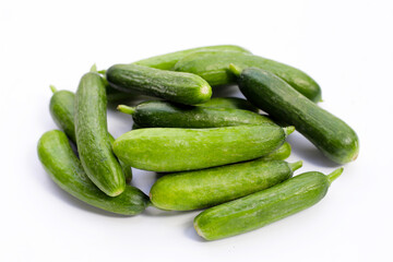 Mini cucumbers on white background.