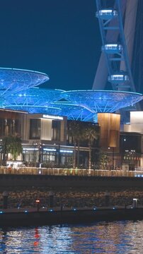 Dubai Marina Port, UAE, United Arab Emirates. Yaht boat floating near Ain Dubai is the world's largest observation wheel located on Bluewaters Island in Dubai, United Arab Emirates. High quality