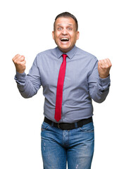 Middle age arab man wearing red tie over isolated background celebrating surprised and amazed for success with arms raised and open eyes. Winner concept.