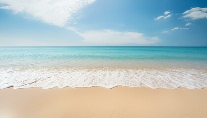 Fototapeta premium Photo of an empty beach overlooking the sea horizon and blue sky. Relaxation, vacation, space for commercial use.