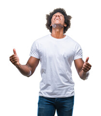 Afro american man over isolated background crazy and mad shouting and yelling with aggressive expression and arms raised. Frustration concept.