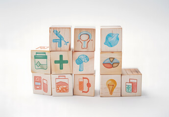 Health insurance concept, Doctor sorting wooden cubes with medical icons design