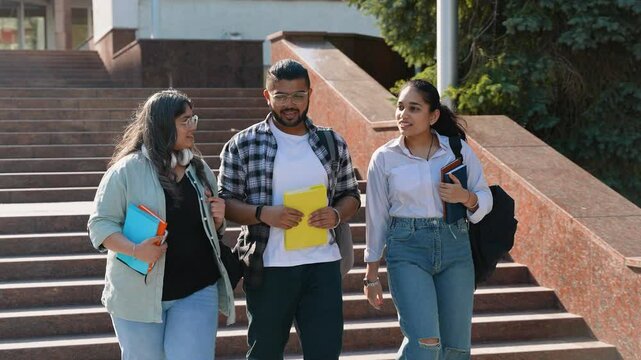 Indian Asian students talking and walking after class in college