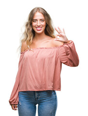 Fototapeta premium Beautiful young blonde woman over isolated background smiling positive doing ok sign with hand and fingers. Successful expression.