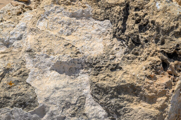 Neutral sandstone (sand stone) texture, seamless repeating pattern suitable for a wallpaper or background