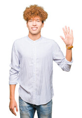 Young handsome business man with afro hair wearing elegant shirt showing and pointing up with fingers number five while smiling confident and happy.