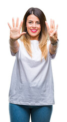 Young beautiful woman casual white t-shirt over isolated background showing and pointing up with fingers number nine while smiling confident and happy.