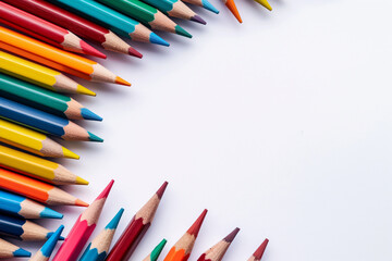 Fototapeta premium background made of colorful wooden pencils on white background, back to school banner concept