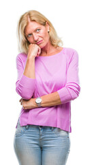 Middle age blonde woman over isolated background thinking looking tired and bored with depression...