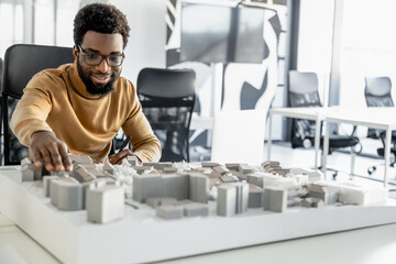 African american architect working in his office and looking involved