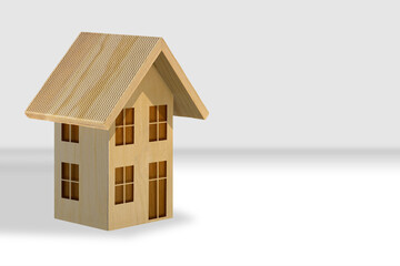 Wooden home model with copy space - Construction industry and building activity concept